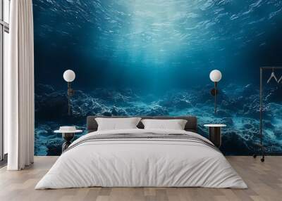 Sun rays pierce the water�s surface, casting light on the coral reef below. Wall mural