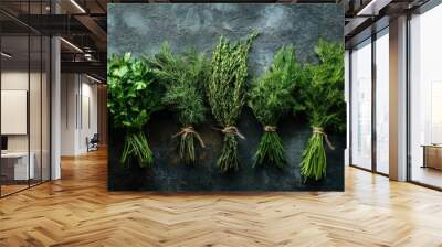 Bunches of fresh raw herbs - rosemary, thyme, dill, parsley and sage on a textured background Wall mural