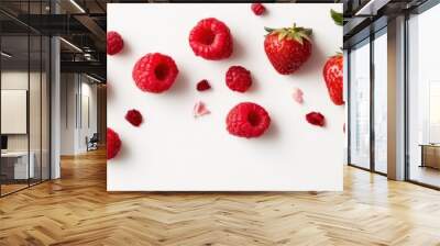 Scattered Raspberries and Strawberries on White Background Wall mural