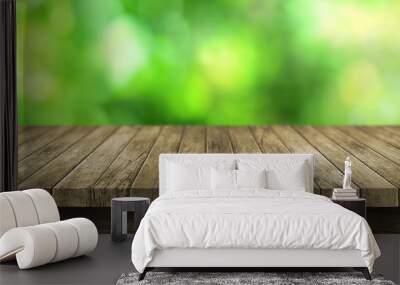 wooden table top with blurry green background Wall mural