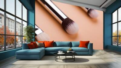 Make up brush lie on a beige background Wall mural