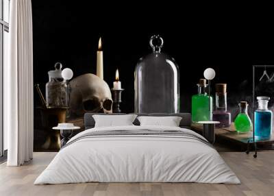  Witchcraft halloween concept with potions, herbs and occult equipment. Candles, magic potions and ancient books. Magical still life on a dark background. Wall mural