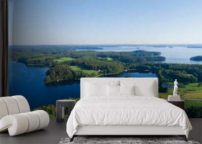 Aerial view on the bridge over the lake. Blue lakes, islands and green forests from above on a sunny summer morning. Lake landscape in Finland, Paijanne. Wall mural