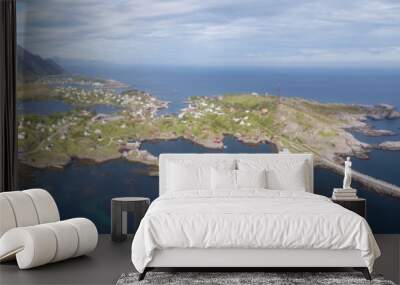 Beautiful aerial panorama of the blue sea surrounding the fishing village and rocky peaks Reine, Moskenes, Lofoten, Norway, sunny arctic summer Wall mural