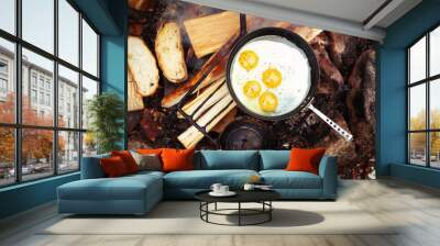 Eggs in small frying pan on bonfire. Camping in the forest.  Wall mural