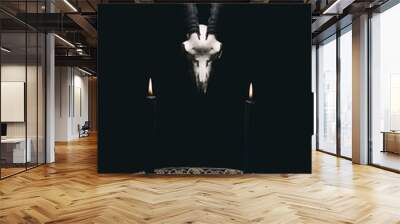 Witchcraft composition with goat skull, candles and pentagram symbol. Halloween and occult concept, black magic ritual. 
 Wall mural