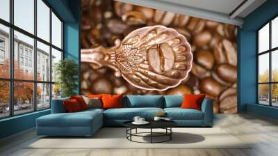 Top down view on isolated on vintage bronze spoon with one single isolated coffee bean, blurred beans background Wall mural