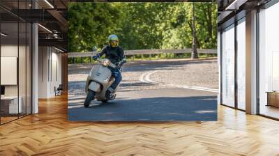 Man riding a classic scooter Wall mural