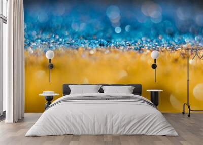 Yellow-blue bokeh on a black background. Defocused. Wall mural