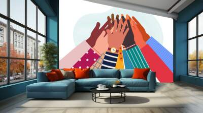 Hands of diverse group of people together raised up. Concept of support and cooperation, friendship. Wall mural