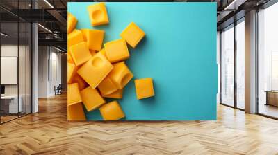 cheddar cheese isolated on blue background Wall mural