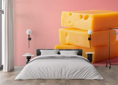 cheddar cheese isolated on pink background Wall mural