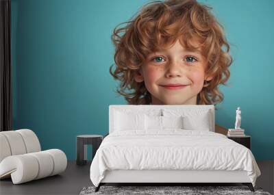 little boy holding glass of milk isolated on blue background Wall mural