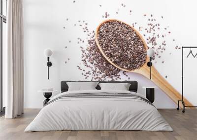 Chia seeds in wooden spoon isolated on white background. Superfood concept. Top view Wall mural