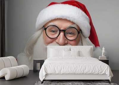 Santa Claus with his glasses, white beard and Christmas hat looking at the camera and smiling Wall mural