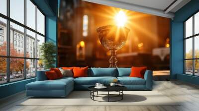 A communion chalice glowing with divine light, set on an altar Wall mural