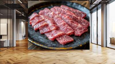 A plate of thinly sliced marbled beef, showcasing its rich texture and color, ideal for grilling or sashimi dishes. Wall mural