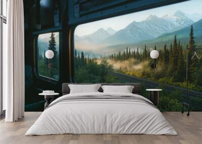 A scenic view from a train window showcasing mountains, forests, and misty landscapes. Wall mural