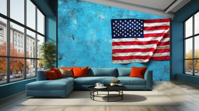 A weathered American flag against a textured blue background, symbolizing patriotism and national identity. Wall mural