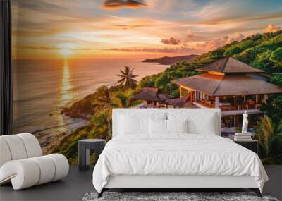 aerial view of a luxury beach resort with a swimming pool on top of hill, on a tropical island, at sunset, with a blue ocean, and palm trees. tourism and vacation concept. Wall mural