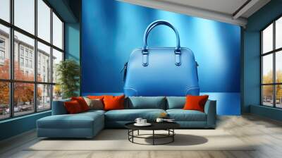 blue woman's leather handbag on a blue background Wall mural