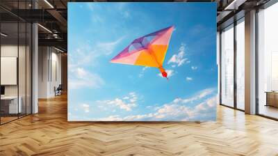 colorful kite flying in the blue sky Wall mural