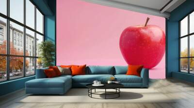 red apple isolated on a pink background Wall mural