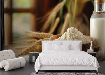 wheat flour in a wooden bowl on a wooden table with wheat and a milk glass bottle Wall mural