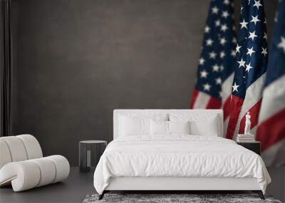 American flags over gray wall, 4th of july panoramic background with copy space Wall mural