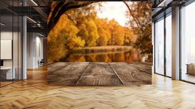 Autumn background, close up of old empty wooden table over the lake with copy space Wall mural