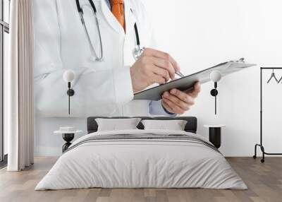 Doctor writing notes at the clipboard isolated on white Wall mural