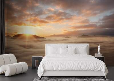 Nature background, sunset above the clouds with copy space Wall mural