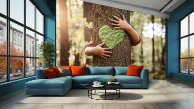 Nature lover, close up of child hands hugging tree with copy space Wall mural