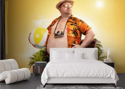 Ready for the holidays, travel concept. Funny overweight man standing out of the suitcase Wall mural