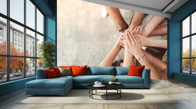 Teamwork, unity concept, group of friends put their hands together with copy space Wall mural