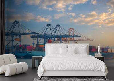 Logistics and transportation of Container Cargo ship and Cargo plane with working crane bridge in shipyard at sunrise, logistic import export and transport industry background Wall mural