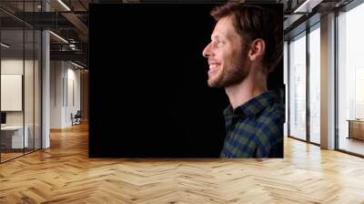 Closeup profile view of happy bearded hipster man smiling Wall mural