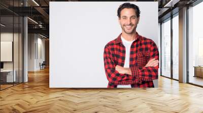 Portrait of happy Hispanic hipster man smiling with arms crossed Wall mural