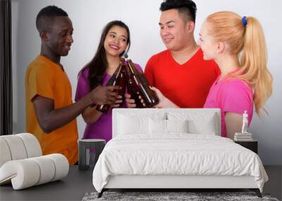 Studio shot of happy diverse group of multi ethnic friends smili Wall mural