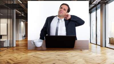 Studio shot of young Persian businessman thinking while having n Wall mural