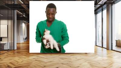 Young African man making funny face while holding cute cat Wall mural