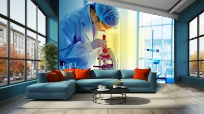 Asian scientist or doctors use microscopes to test for the coronavirus (COVID-19). Or a new flu virus to save human life In the lab Or hospital. Successful in researching the treatment of patients Wall mural