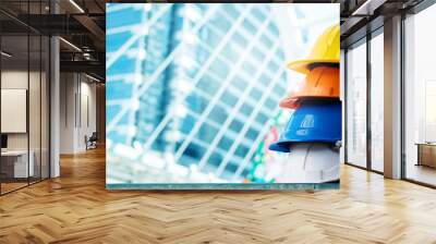 Multicolored Safety Construction Worker Hats. Teamwork of the construction team must have quality. Whether it is engineering, construction workers. Have a helmet to wear at work. For safety at work. Wall mural