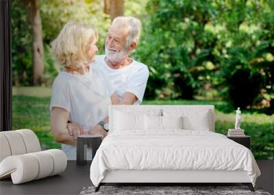 Senior Caucasian Women and men Standing in garden during summer Which is lover who has been caring for long time Take care of health And travel together in retirement Concepcion insured the elderly Wall mural