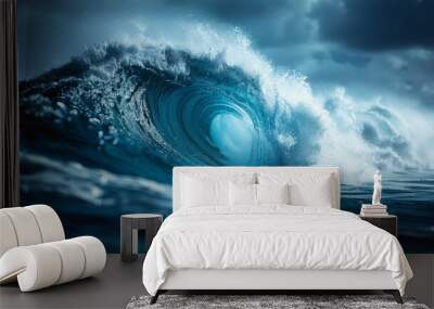 ocean wave breaks under cloudy sky, water fluid motion on electric blue horizon Wall mural