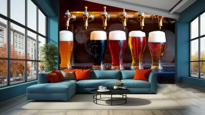 A beer tap pouring into a collection of glasses.  Wall mural