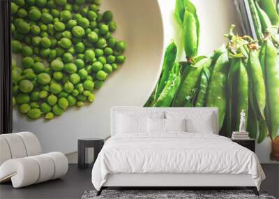 Green peas on a white plate Wall mural