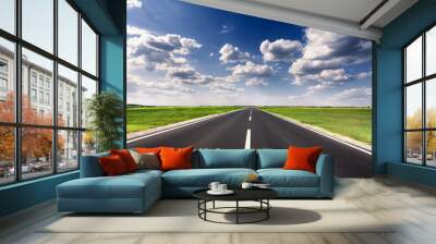 driving on empty asphalt road at idyllic sunny day Wall mural