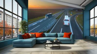 Two buses in motion blur on the highway at sunset Wall mural