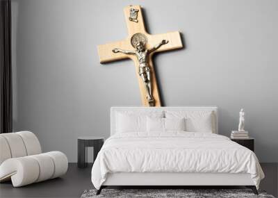 A wooden cross with Jesus hanging. INRI. Isolated with gray background. Wall mural